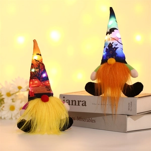Glowing Halloween gnome plushies with LED lights and festive castle pumpkin prints