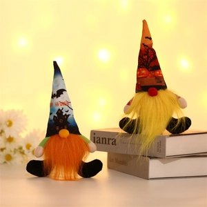 Detail of Halloween gnome plush ornaments with glowing orange and yellow long beards