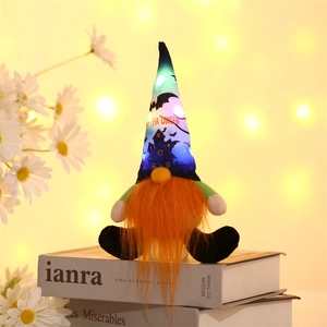 Detail of LED glowing Halloween gnome with orange beard and Happy Halloween hat