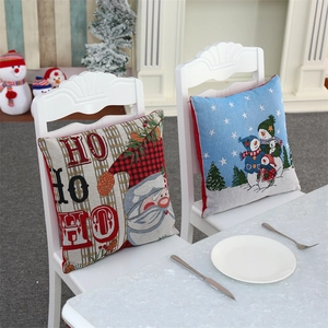 Detail of Christmas pillow covers with knitted textures featuring Santa and snowman patterns