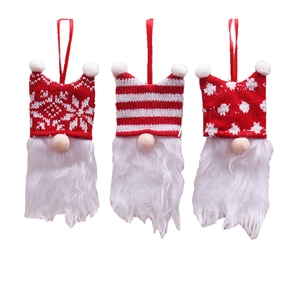 Three Christmas gnome hanging ornaments with red and white knitted hats and plush beards