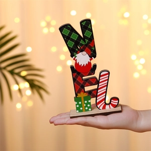 Close-up of wooden NOEL Christmas gnome table centerpiece with plaid and candy cane details