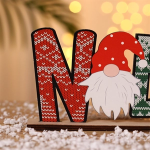 Macro detail of wooden Christmas Noel gnome ornament with festive knit texture print