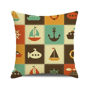 Detailed view of nautical pillow cover with anchor and sailboat prints on linen fabric