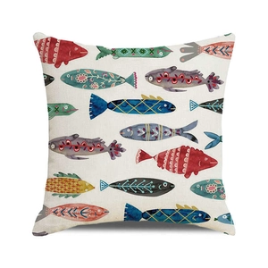 Detailed view of square pillowcase featuring folk art fish patterns on linen fabric