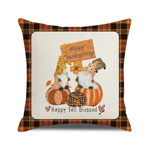 Close-up of Thanksgiving pillow cover with fall gnomes, pumpkins and sunflower motifs
