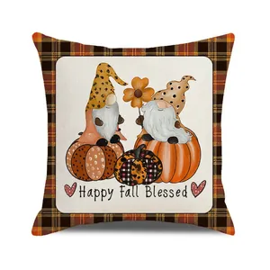 Detail of fall gnome pillow cover with pumpkin graphics and Happy Fall Blessed text