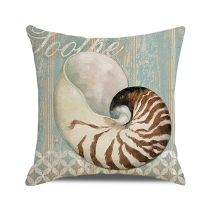 Close-up of nautical pillow cover featuring a vintage nautilus print on striped fabric