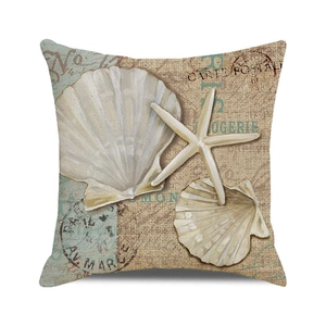 Close-up of linen cushion cover showing watercolor starfish and vintage postcard print