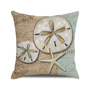 Close-up of ocean-themed sand dollar and starfish prints on textured linen cushion cover