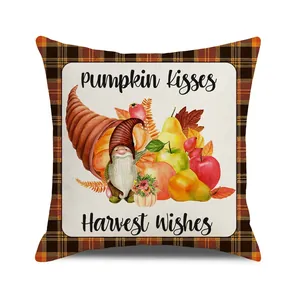Detail of harvest gnome pillow cover with pumpkin kisses text and plaid pattern border