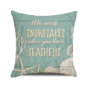 Detail of teal seashell pillowcase featuring sea stars and nautilus on wood texture