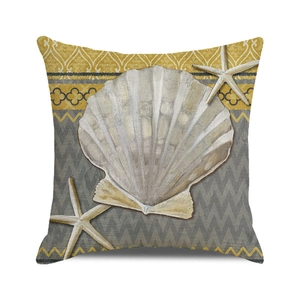 Macro detail of nautical cushion cover featuring watercolor scallop and starfish patterns