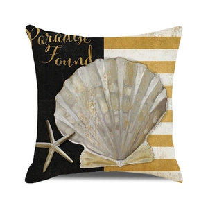 Detail of nautical cushion cover with realistic scallop, starfish and gold Paradise Found text