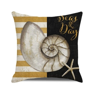 Macro detail of nautical pillow cover showing nautilus pattern and Seas the Day text