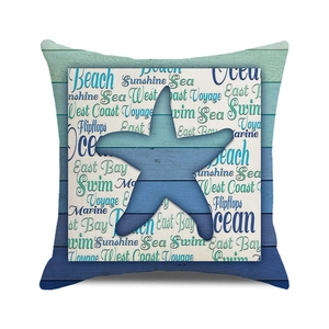 Detail of starfish print and vintage blue wood pattern on watercolor sofa cushion cover