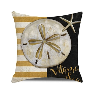 Detail of linen pillow cover with nautical sand dollar, starfish, and Vitamin Sea text
