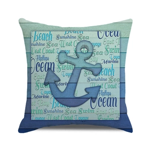 Close-up of nautical square cushion cover with blue anchor print and beach themed text