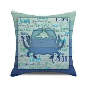 Detail of square pillowcase with blue crab silhouette and coastal wood plank pattern