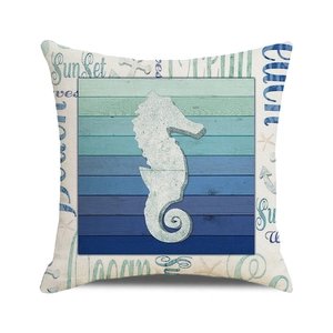 Detail of nautical cushion cover featuring a white seahorse on blue wood grain texture