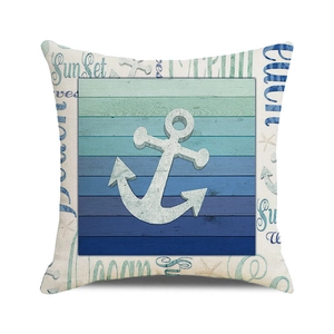 Detail of nautical cushion cover featuring a white anchor on blue teal wood grain background