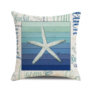 Detailed close-up of linen pillow cover with starfish print and rustic beach wood texture