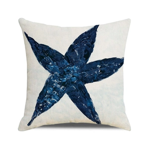 Detailed macro view of the linen texture and blue starfish watercolor print on pillowcase