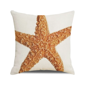 Detailed view of square pillowcase with realistic orange starfish print on textured fabric
