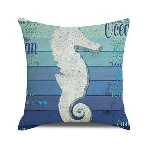 Close-up of nautical seahorse cushion cover with blue wooden texture print