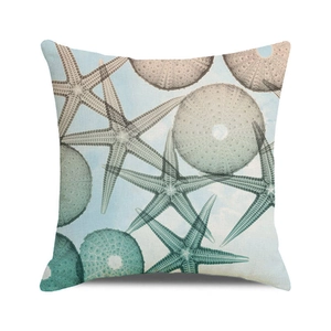 Detail of square cushion cover with starfish and sea urchin print on linen fabric