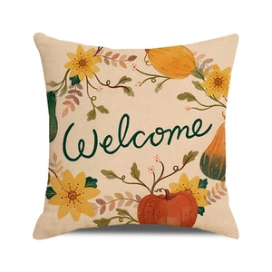Detail of fall harvest pumpkin and sunflower print on beige linen pillow cover