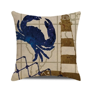 Close-up of nautical pillow cover featuring blue crab and lighthouse print on cotton linen