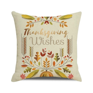 Detailed close-up of Thanksgiving pumpkin and autumn leaf print on textured cushion cover