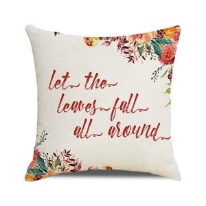 Close-up of autumn pumpkin watercolor print on linen pillowcase with fall leaf design