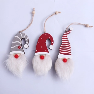 Three glowing wooden Christmas gnome pendants with plush beards and decorative strings