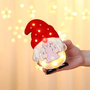 Detail of LED lighted Easter gnome with pink rabbit pattern and soft warm glowing lights