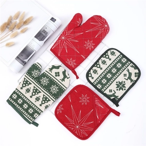 Detailed set of Christmas kitchen oven mitts and potholders with reindeer and snowflake motifs