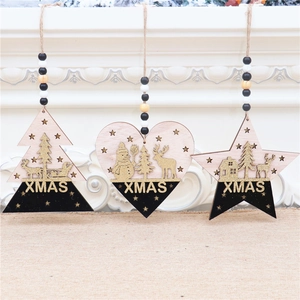 Close-up of wooden XMAS ornaments with gold glitter reindeer and snowman on a mantel