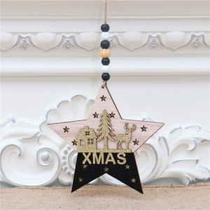 Detail of wooden star Christmas ornament with gold glitter reindeer and XMAS text