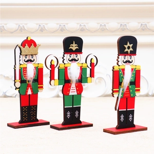 Three colorful wooden nutcracker soldiers on a festive tabletop with soft lighting decoration