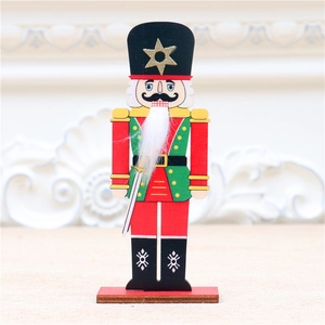 Detailed view of colorful wooden nutcracker soldier figurine on red base for Christmas