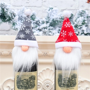 Christmas gnome wine bottle covers with snowflake knit hats in red and grey