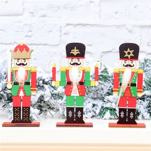 Three classic wooden nutcracker soldiers with glitter details on a snowy background