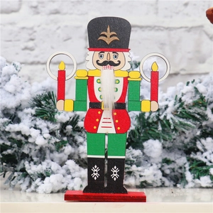 Close-up of wooden Nutcracker soldier ornament with red candle holders on white brick wall