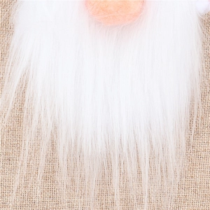 Close-up of plush white gnome beard with round felt nose for Christmas bottle decor