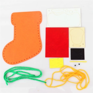 DIY Christmas felt stocking craft kit with colorful felt pieces and sewing tools