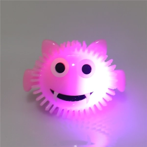 Jouet lumineux monstre rose avec pointes souples et lumière LED pour fête