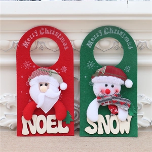 Detail of felt Santa Noel and Snowman door hangers for Christmas festive decoration