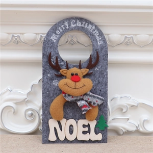 Detail of felt Christmas reindeer door hanging with Noel text and Merry Christmas print