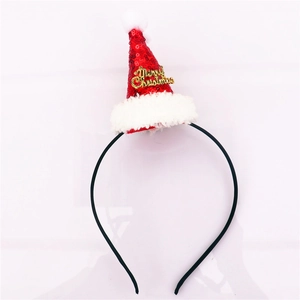 Dettaglio del cerchietto con mini cappello di Babbo Natale di paillettes e scritta oro